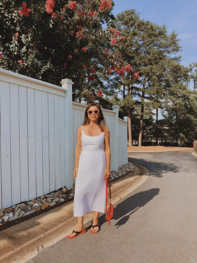 Travel blogger in white dress, seeking collaborations