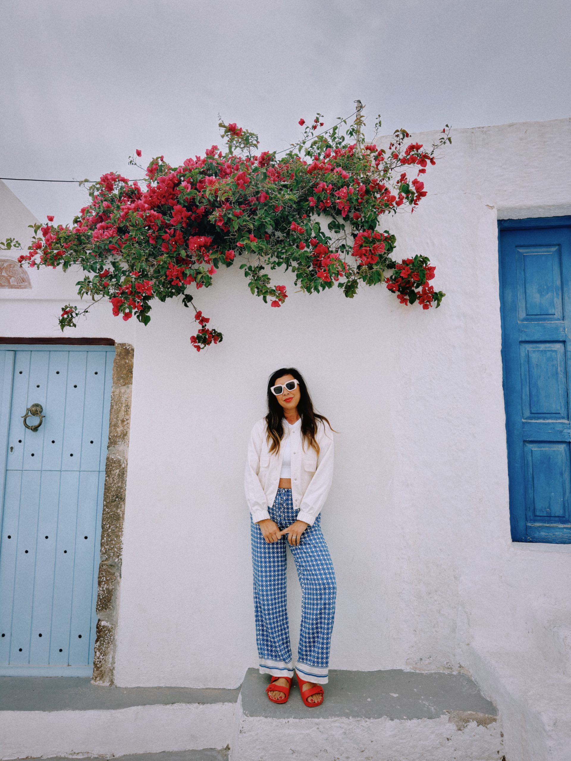 Betty wearing a destination outfit in Megalochori, Santorini