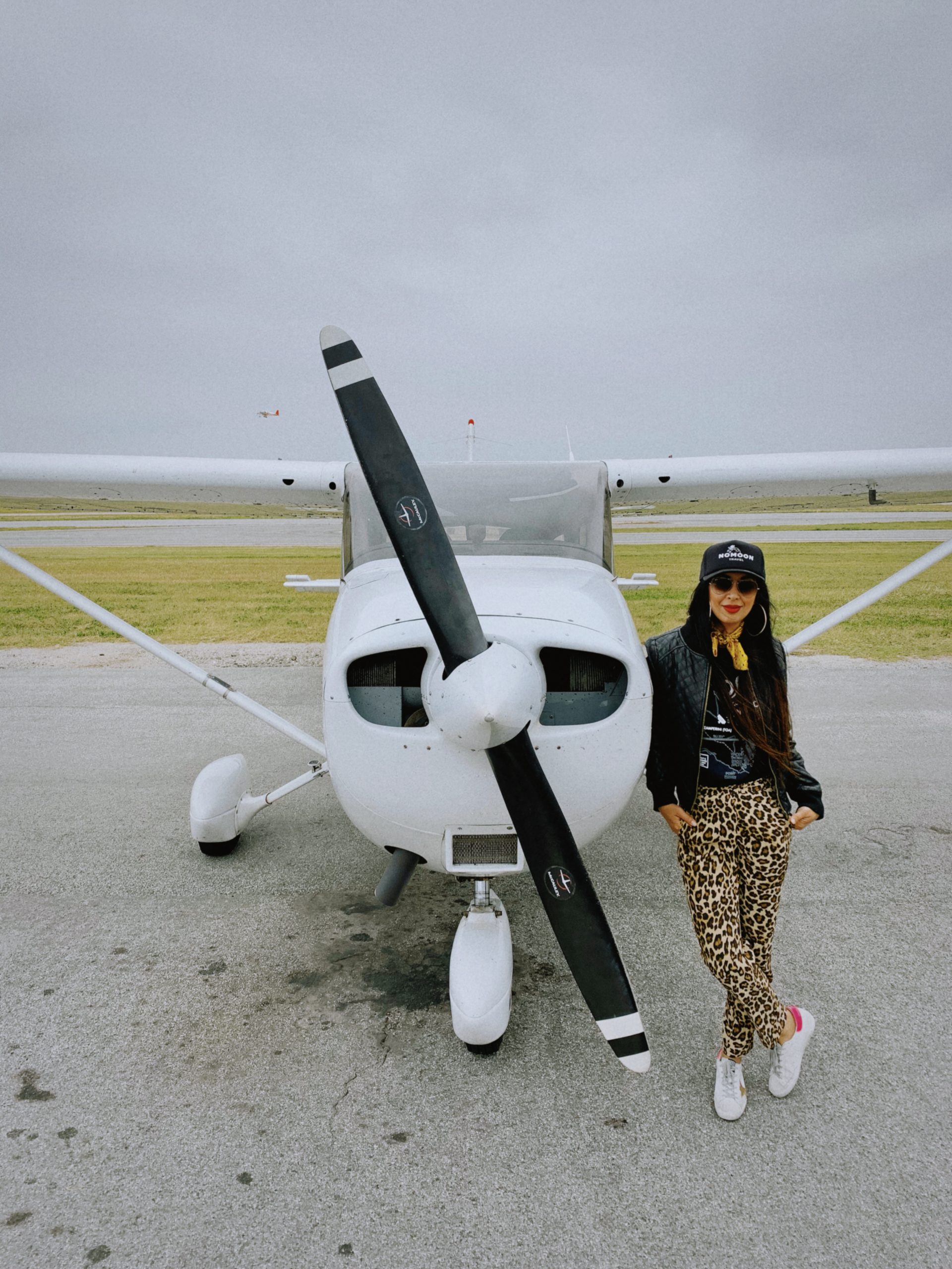 Betty in the cockpit of a vintage Cessna airplane