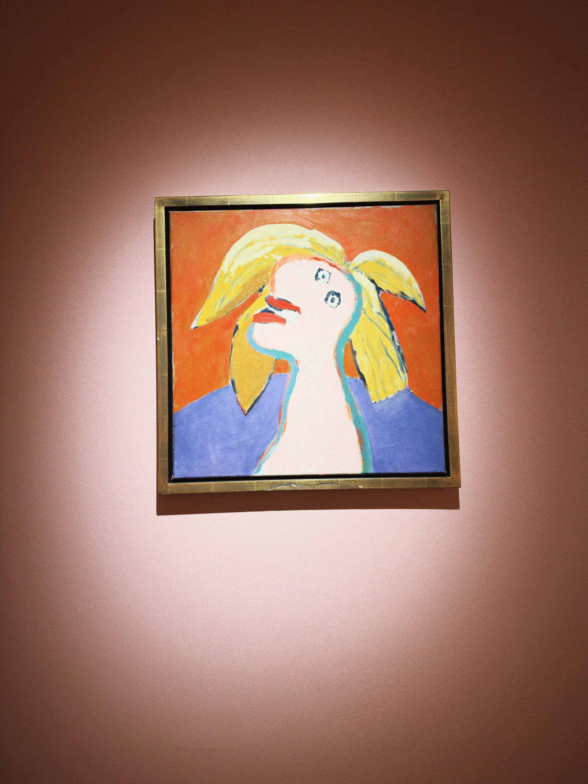 Abstract portrait of a woman against an orange background at an Istanbul art museum