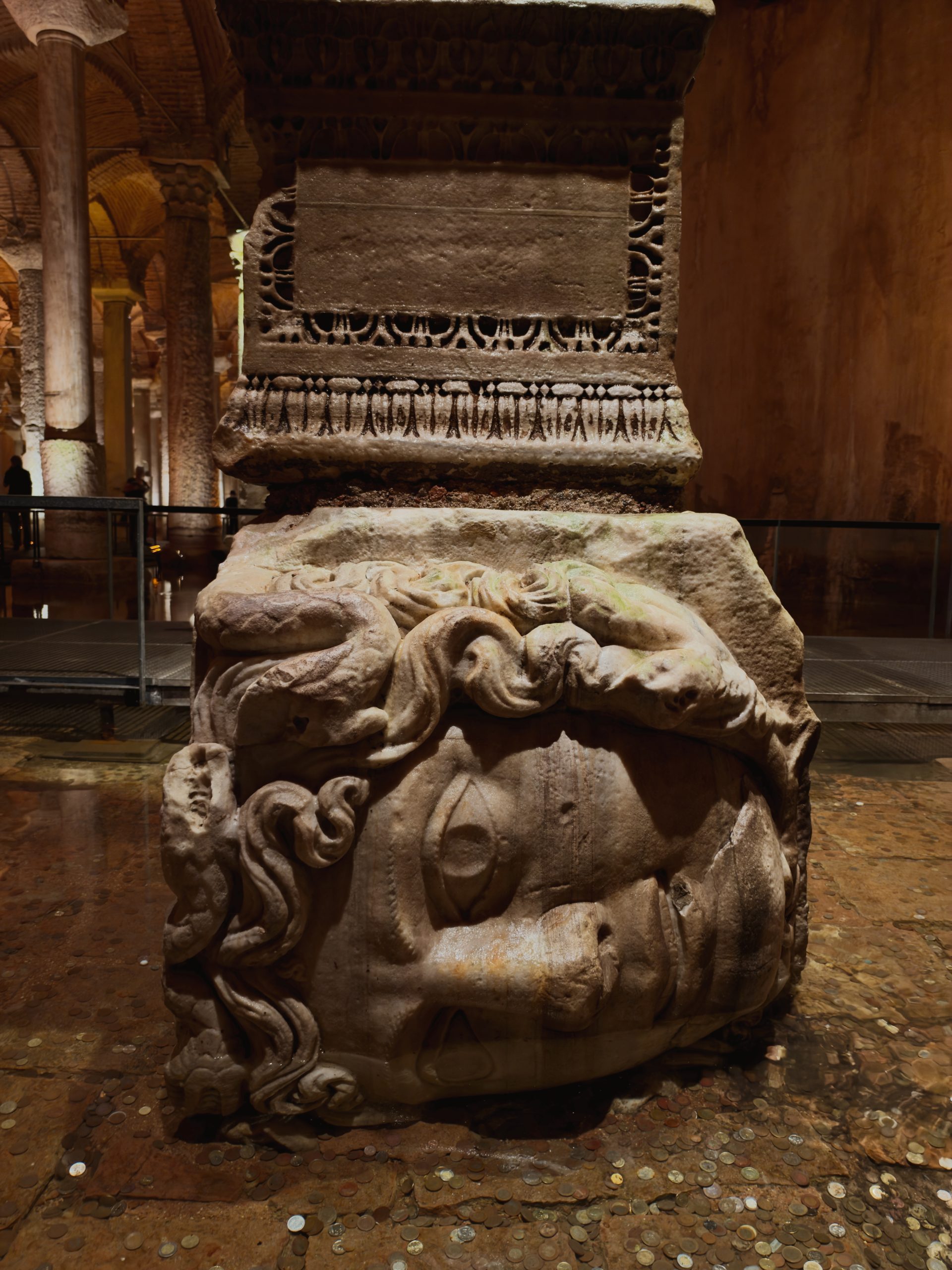 Ancient Medusa head used as a column base inside the Basilica Cistern