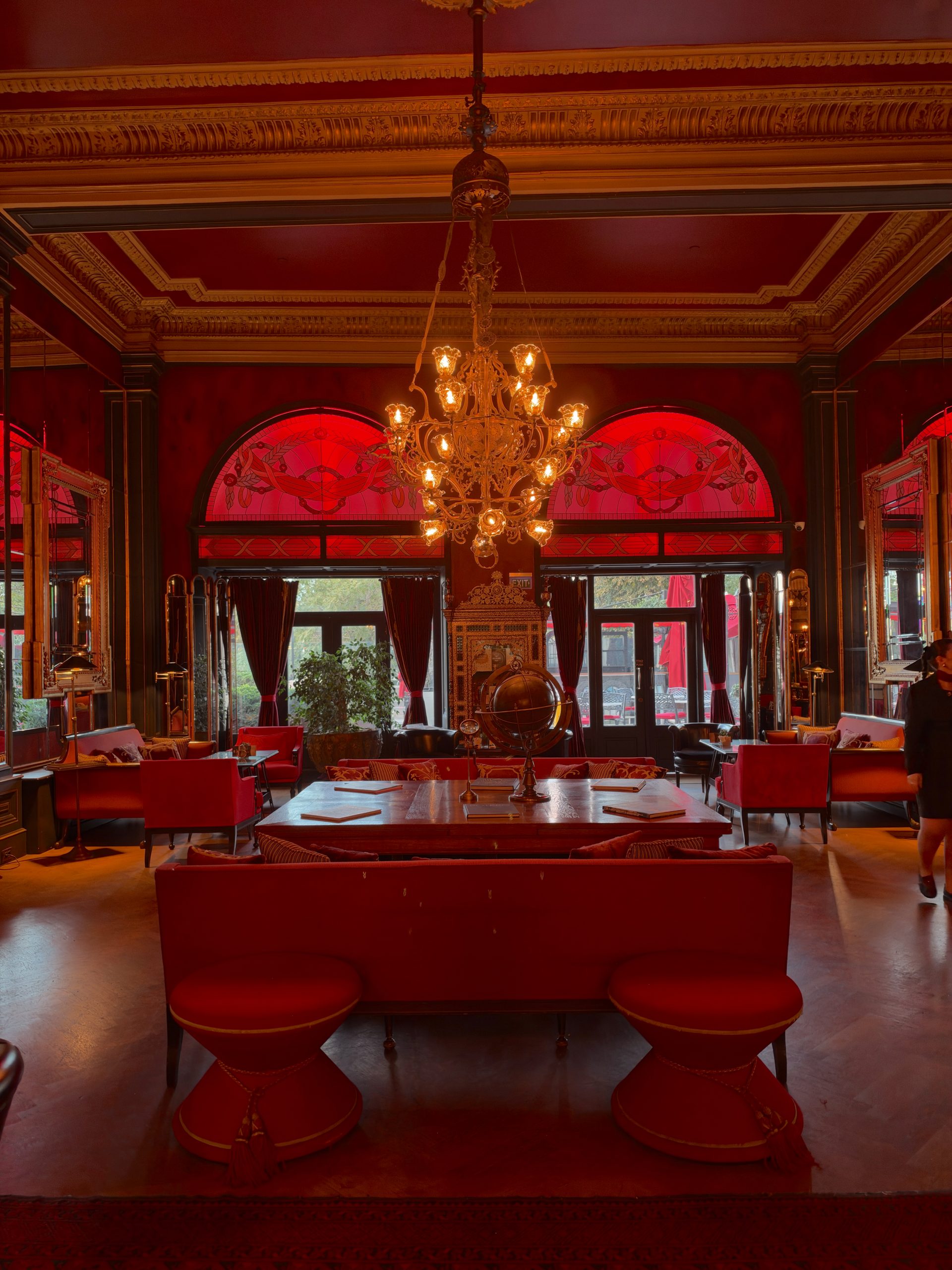 Historic lounge, chandelier and illuminated globe inside Pera Palace Hotel