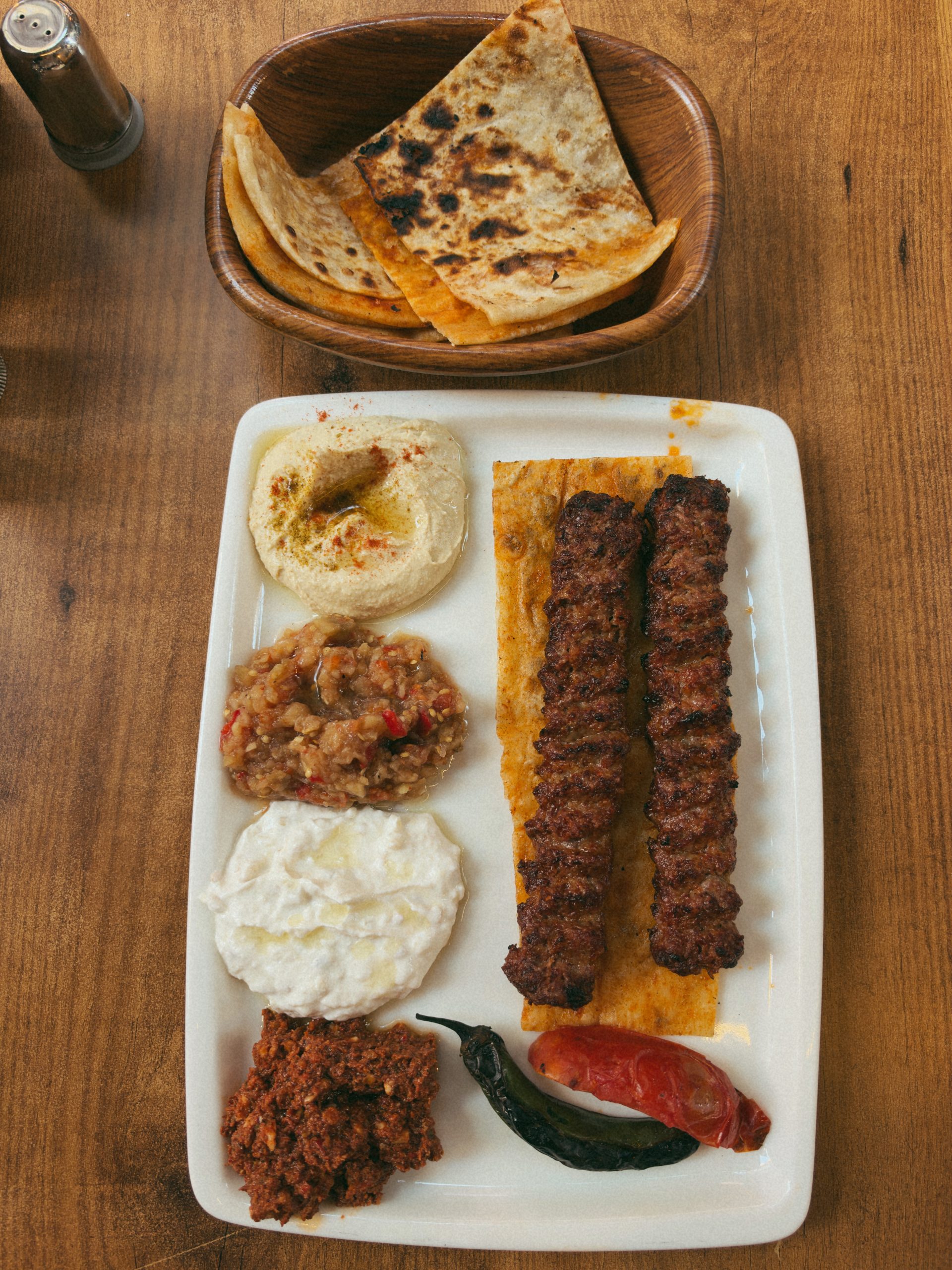 Turkish kebab platter served with hummus, salad and bread in Istanbul