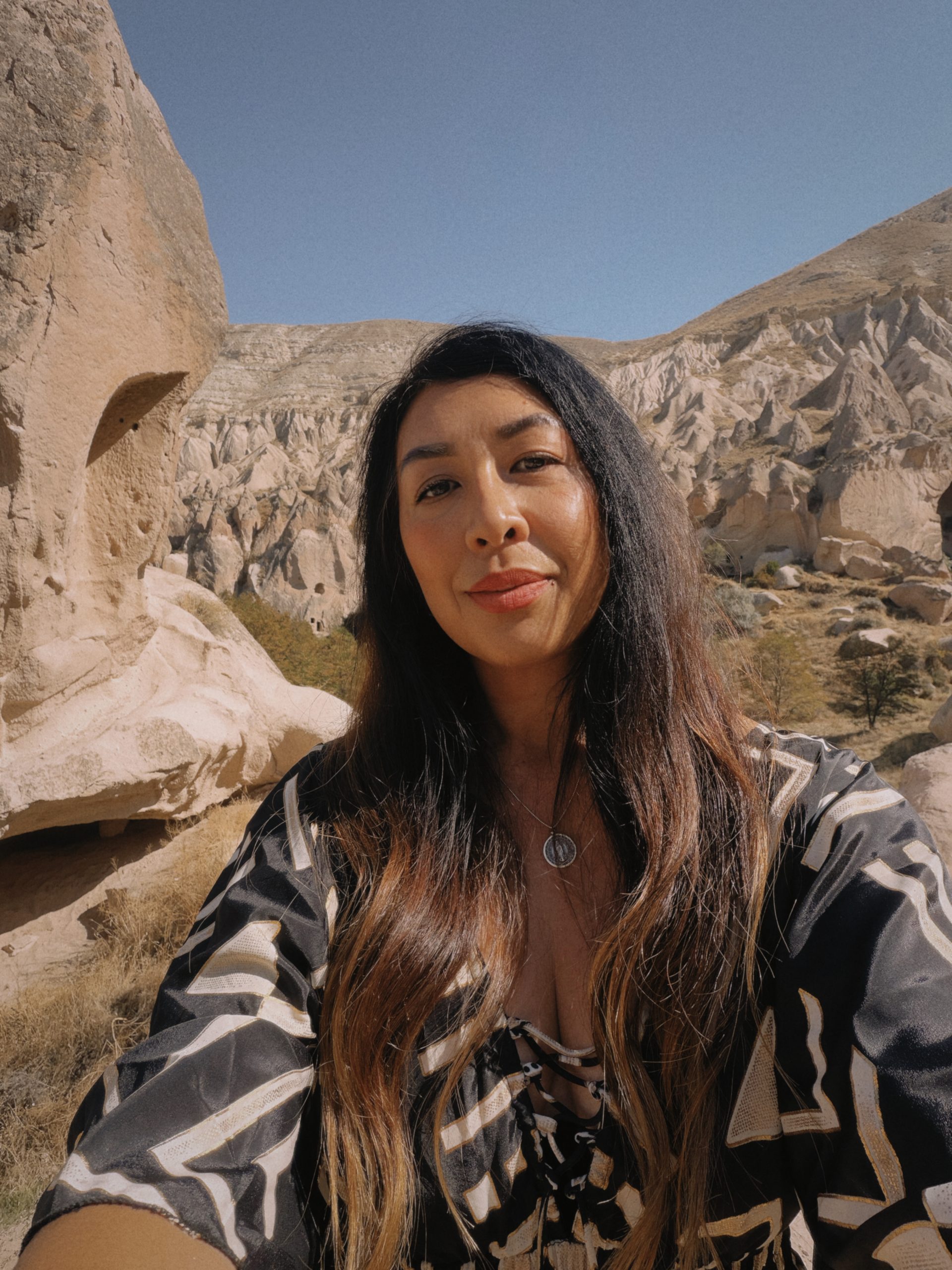 Woman traveling among Cappadocia rock formations